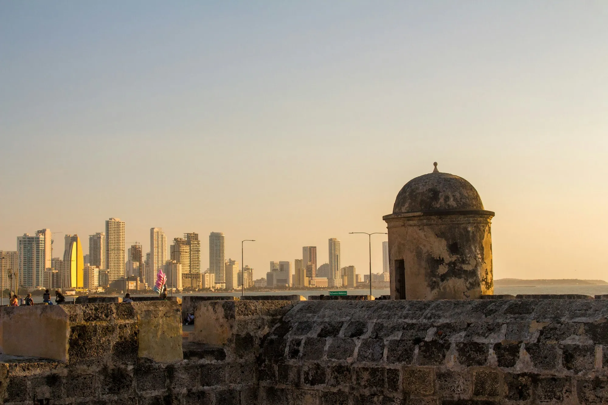 Cartagena's historic walls under a warm sky