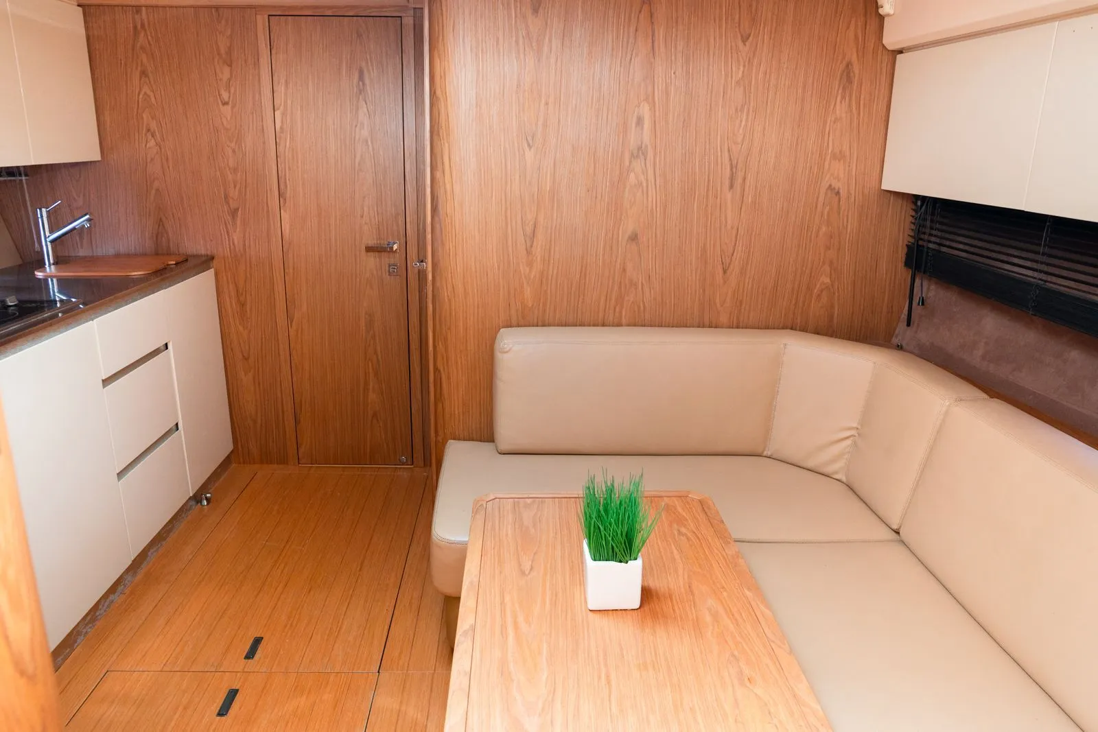 The salon and galley aboard a private yacht